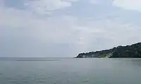 Cape Nordperd seen from Göhren Pier. Left of the cape is the Buskam