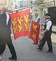 Two-leopard and three-leopard flags at a Norman language festival in Jersey.