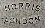 Norris, London in sans serif letter in an ellipse