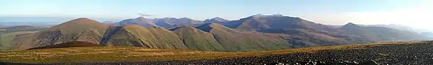 Panorama of some of the Snowdon Massif including Snowdon (centre right) taken from Mynydd Mawr.  The Glyderau are visible in the distance