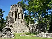 North transept from the south east. The blocked doorway leads to the sacristy