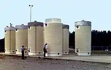 Image 37Dry cask storage vessels storing spent nuclear fuel assemblies (from Nuclear power)