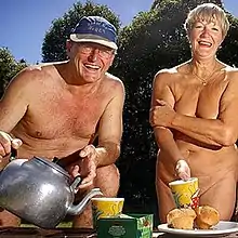 Image 27A publicity photo showing a mature naturist couple making tea. North America (from Naturism)