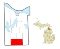 Location within Cheboygan County (red) and an administered portion of the village of Wolverine (pink)