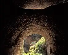 Inside view of the "tunnel" of the Roman Nysa Bridge, a tunnel-like substructure at Nysa on Meander, Caria, Asia Minor, to the west, downstream; between the arch in the front and in the back is the collapsed ssection