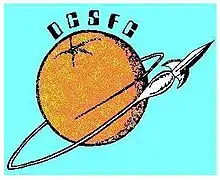 An orange orbited by a rocket as if it were a planet