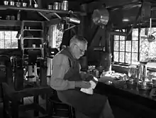 A tinsmith demonstrates how tinware was produced