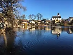 Church of Saint John the Baptist behind a pond