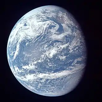 Image 21A view of Earth with its global ocean and cloud cover, which dominate Earth's surface and hydrosphere; at Earth's polar regions, its hydrosphere forms larger areas of ice cover. (from Earth)