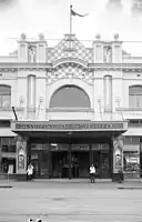 Image showcasing the theatre's iconic checkered parapet and led light windows. Marquee advertising guest Wurlitzer organist, Manny Aarons