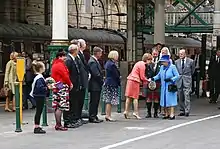 Elizabeth and Philip greeting a crowd