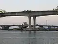 The old bridge in the background with the new bridge in the foreground.