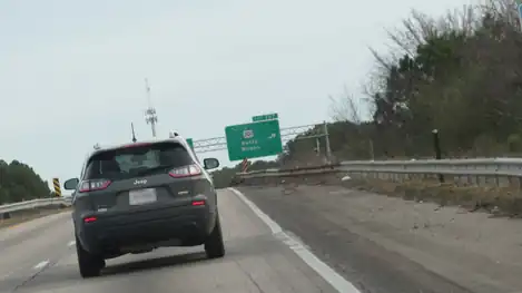 Before July 2022, a sign showing a slightly covered part of the I-95 Bus. shield with the words "NORTH"