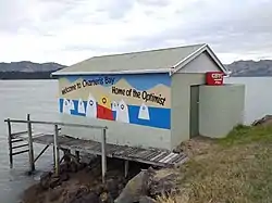 The boat shed at Charteris Bay recording its association with the Optimist Dinghy