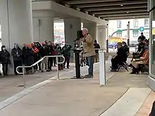 Minnesota Governor Tim Walz speaking at the opening ceremony of the Metro Orange Line.