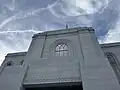 The Orem Utah Temple, showing a closeup of the stonework. Patterns show various motifs such as cherry blossoms, and an egg and dart motif.