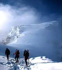 Image 7Mountaineers proceed across snow fields on South Tyrol; other climbers are visible further up the slopes. (from Mountaineering)