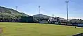 Cal Poly Mustangs baseball players practice in the outfield before a home game during the 2023 season.