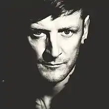 black-and-white close-up of Ozark Henry, staring intently at camera