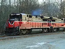 A pair of P&W diesel locomotives on a track. Exhaust can be seen from the lead locomotive, indicating it is on. The locomotives are numbered 4004 and 3907.