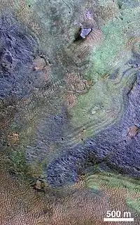 Nili Fossae on Mars - largest known carbonate deposit.