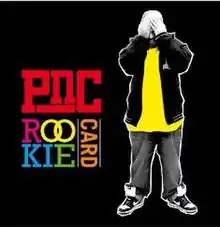 Black square with multicolored text reading "PNC Rookie Card" and a man in yellow and black hiding his face.