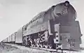 PRR Q1 6130 pulling a Freight Train