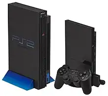 Slimline (right) and Original (left) PS2 consoles