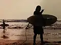 Surfers at Crystal Pier in Pacific Beach, California.