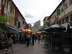 Image 5Restored shophouses running along a street in Chinatown, which reflects the Victorian architecture of buildings built in Singapore during the earlier colonial period, with styles such as the painted ladies. (from History of Singapore)