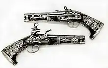 Pair of Miquelet Pistols, in the Peninsular Spanish style, made in colonial Mexico, dated 1757, at the Metropolitan Museum of Art