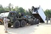 Oshkosh M1075A0 PLS truck showing the LHS and CHU