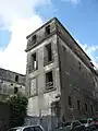 The side of the building looming over San Gaspare del Bufalo Street (June 2009).