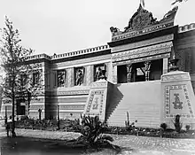 Black-and-white photograph of a palace that is based on the Aztec culture.