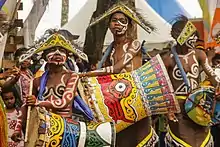 Tifa drummers, part of a tambur-flute ensemble. Such a group can include several tifa drummers,  several flute players, and one leader of the line