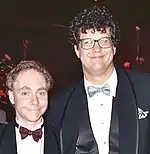 Photographic portrait of Penn Jillette (right) and Teller (left)