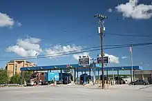 Smaller toll plaza, with semi-trailer truck at a booth