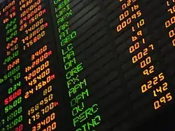 Looking up at a computerized stocks-value board at the Philippine Stock Exchange