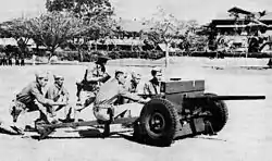 Philippine Scouts at Fort William McKinley firing a 37 mm gun in training. Note the lowered wheel segments.