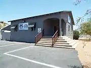 The Charles and Eleanor Abel House was built in 1955 and is located at 11430 Cave Creek Road. It was the first house in Sunnyslope with a bomb shelter which also served as a basement.  The residence is now used for commercial purposes.