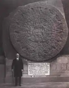 Photograph from 1910 of the sun stone with (then president) Porfirio Díaz