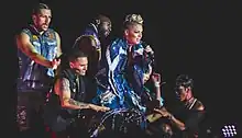 Pink onstage with several other performers