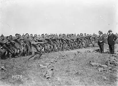 H678. The Pioneer Battalion performing a haka for Prime Minister William Massey and Sir Joseph Ward at Bois-de-Warnimont, 30 June 1918. Photo: Henry Armytage Sanders