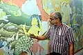 P. K. Sadanandan working on his mural