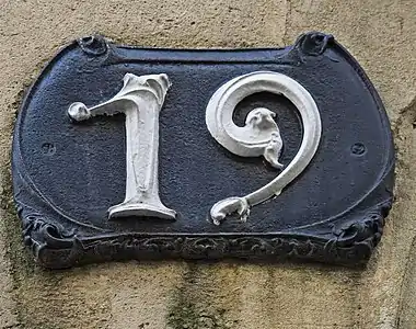 House number plaque at Castel Beranger