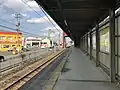 A view of the station platform. Note there is no entrance to the station from the main road on the north side of the track (to the left).