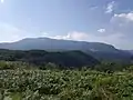 Plesa peak 1,470 metres (4,820 ft) seen from Cornetul mountain.