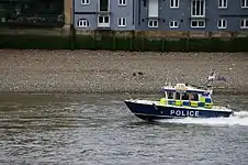 London Metropolitan Police boat John Harriott IV on the Thames.