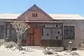 A partially restored building still in use by mine personnel