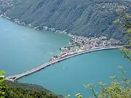 The Melide causeway, with station mid-upper right